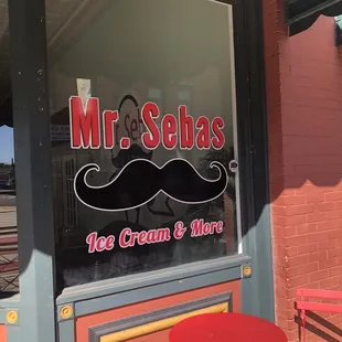 a red table and chairs outside