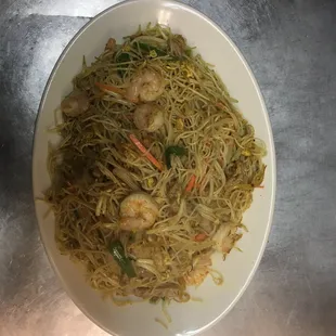 a plate of noodles with shrimp
