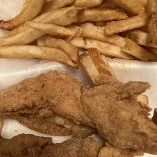 a close up view of the fish and fries