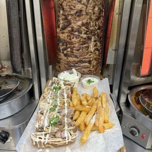 a person holding a tray of food