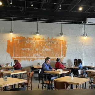 The seating area. The art on the wall says "It always starts with a good pita."