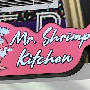 a sign for mr shrimp&apos;s kitchen