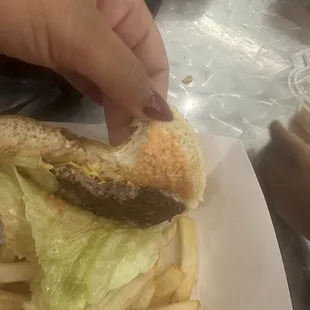 Burned and thin patty with very cold fries
