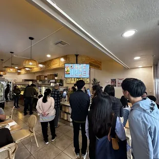 a large group of people in a restaurant