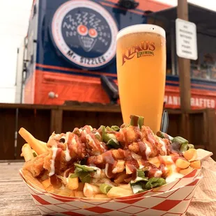 Happy Hour Fries (cheese, fries, breaded chicken, green onions, bbq and ranch sauce.)