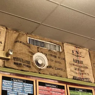 Bags that once held coffee beans as wall decor.