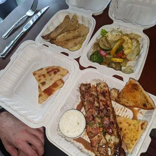 Chicken souvlaki platter, comes w pita and tzatziki plus two sides of your choice. We chose the oven roasted potatoes and grilled veggies.