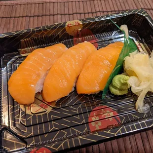  two pieces of sushi on a tray