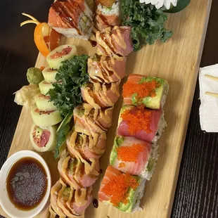 Far right: Tokyo roll, bottom left: fancy rainbow roll, top left: regular rainbow roll, middle: Spider-Man roll