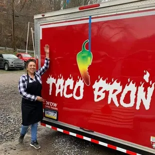 a woman standing in front of a truck