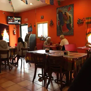 people sitting at tables in a mexican restaurant
