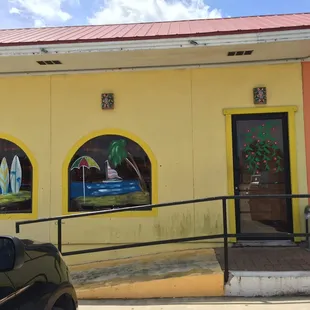 a car parked in front of a restaurant