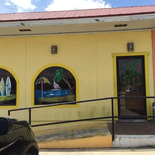 a car parked in front of a restaurant