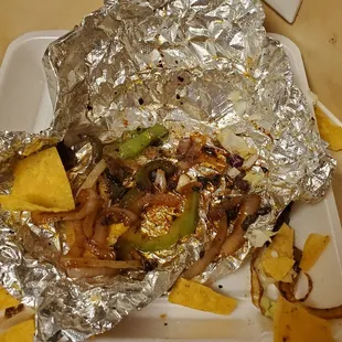 There it is..burnt steak, onions peppers and black beans. With little lettuce.