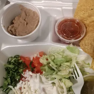 Salad and beans that come with the fajitas