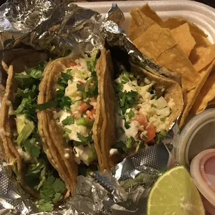 a plate of tacos and chips