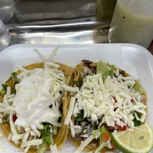  two tacos on a white plate