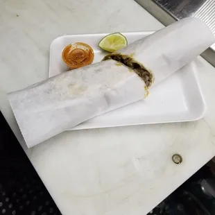  a burrito on a plate