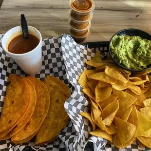 3 Tacos de Birria Combo with a side of guacamole &amp; chips.