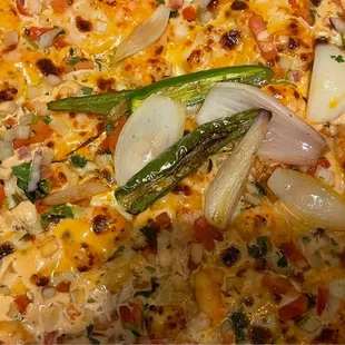 Shrimp Pizza close-up. Tender, thick crust, onions, diced tomatoes, cilantro, plump shrimp, a creamy sauce w/a kick of heat..it all works!