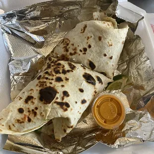 a tortilla in a styrofoam container