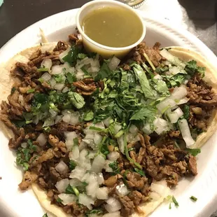 3 steak tacos with their green salsa