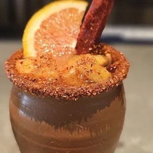 Cantarito is made with tequila and served on a Mexican clay pot. It's so delicious .