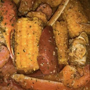 crab legs and corn in a pot