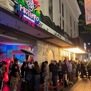 a line of people lined up outside