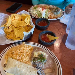 Foreground... steak burrito lunch special with an extra roasted jalapeño.  Farthest Lunch #9 chicken burrito, chili relleno.