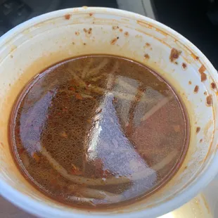 a cup of hot sauce