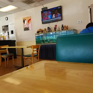 a man sitting at a table in a restaurant