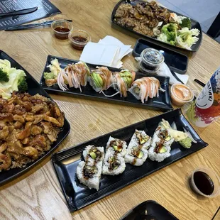Teriyaki chicken with fried rice, eel roll and a tempura shrimp roll.