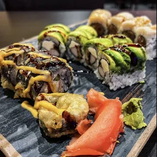 a variety of sushi on a tray