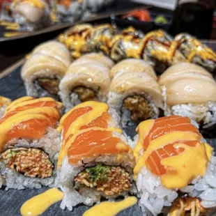 a variety of sushi rolls on a plate