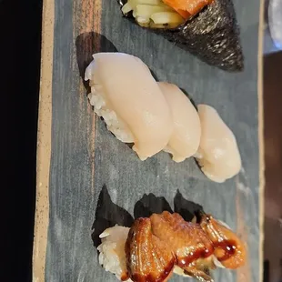 Salmon hand roll, white tuna nigiri, eel nigiri