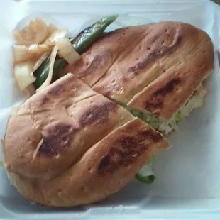 a sandwich in a styrofoam container