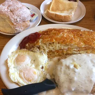 Chicken Fried Steak, hasbrowns, 2 fried eggs, gravy and a mammoth biscuit!! Yum!