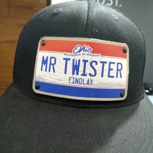 the name plate on the hat