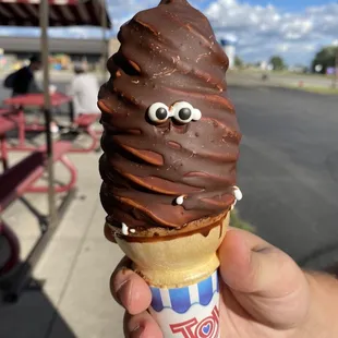 an ice cream cone with googly eyes
