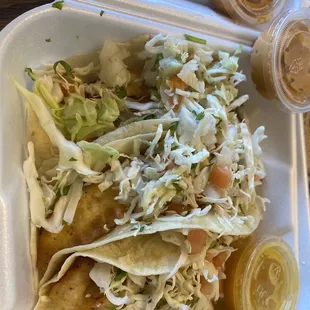 Baja fish tacos--loved the Baja chipotle sauce---And free fish plate while we waited for to go order.
