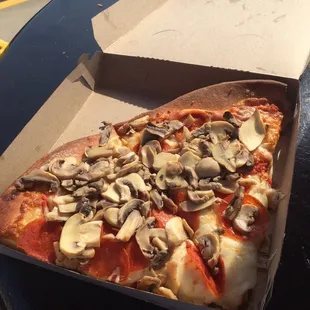 Two slices of Mr Wich pepperoni and mushrooms.  Crispy crust edges. Moist mushroom tasty pepperoni and a touch of unique sauce. Yummy!!
