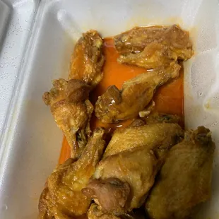 chicken and carrots in a styrofoam container