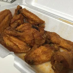 Hot wings? Where's the sauce? I saw them put on sauce. Where is it? ZERO flavor. ZERO hotness. SO DISAPPOINTING. Thats grease on the bottom.