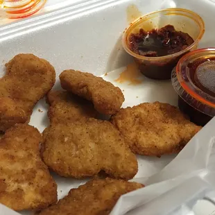 Chicken nuggets with cajun sauce. Bad breading. Thin. Hardly any meat.