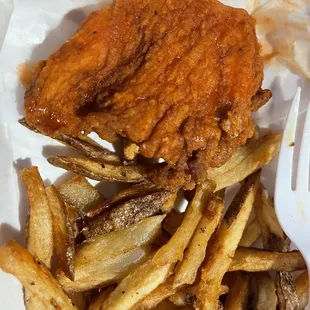 Chicken tender and greasy fries