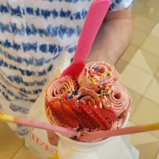  a man holding an ice cream sundae