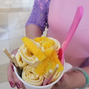  a person holding a bowl of food