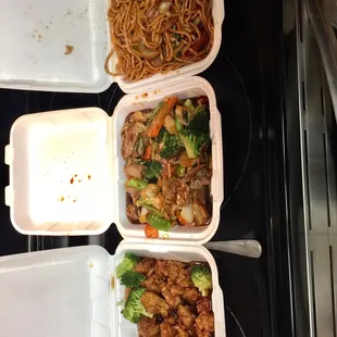 three take out containers of food