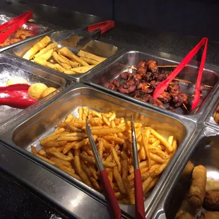 a variety of food items in a buffet